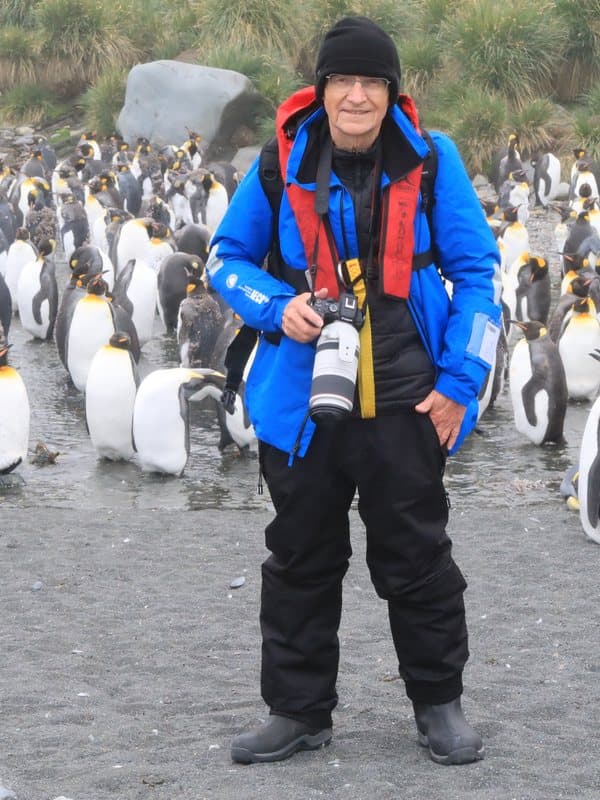John Bishop photographing king penguins in Antarctica